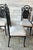 Vintage dining/kitchen chairs. Set of four. Black metal with curved detail back. Seats are a taupe crushed velvet.