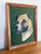 Folk Art oil painting of a dapper dog on a rich green backdrop. Framed beautifully and simply in wood. Unsigned by the...