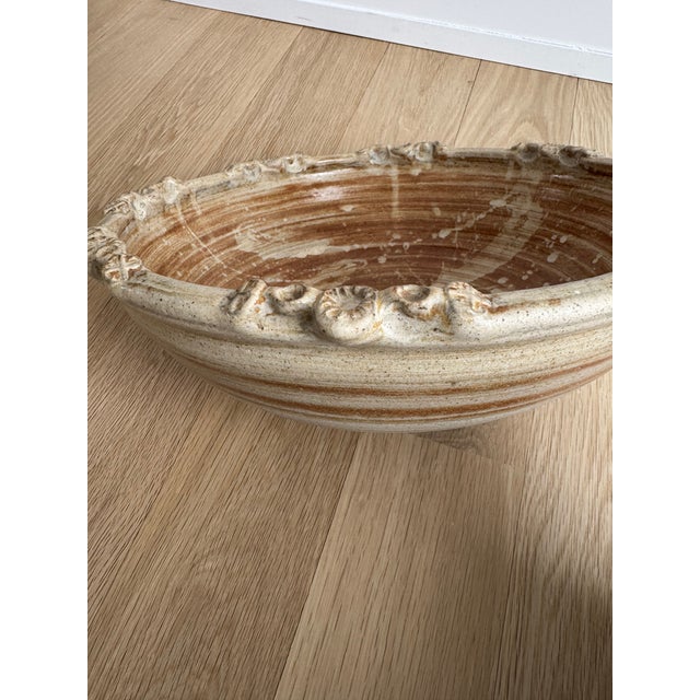 Unique, hand-thrown American studio pottery bowl with strong sculptural presence and organic character. This heavy piece...