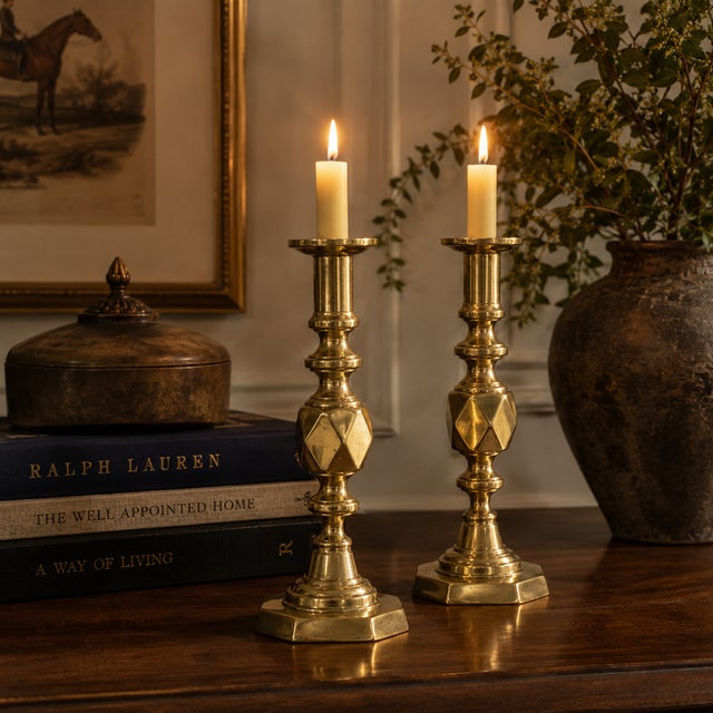 A rare and impressive pair of late 19th-century English brass candlesticks, featuring an elegant octagonal base and...