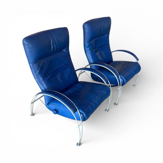 A striking pair of vintage Lafer “Billie” lounge chairs, produced in Brazil and upholstered in rich cobalt blue leather...