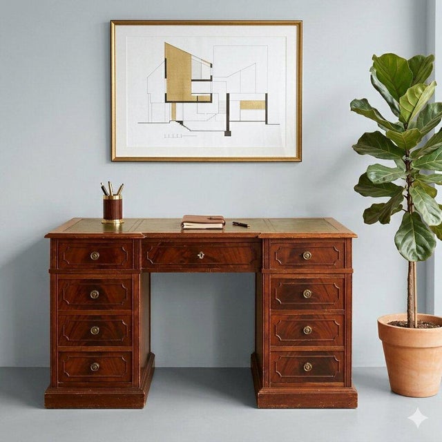 Mahogany desk. Top with green leather insert, three drawers under the top, plus three more on each side. Wrought bronze...