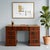 Mahogany desk. Top with green leather insert, three drawers under the top, plus three more on each side. Wrought bronze...