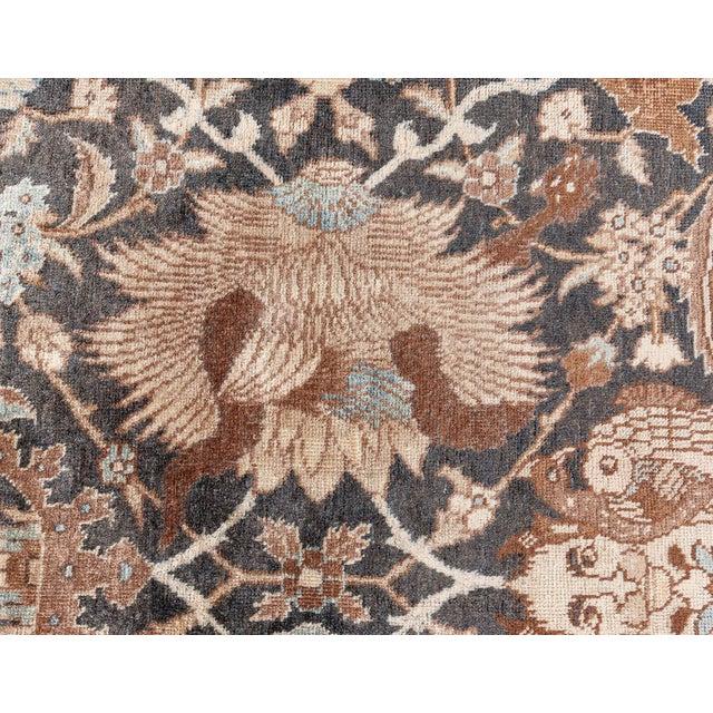 An exceptional late 19th century Persian Tabriz antique carpet, the dark brown with an allover trellis of stylized...