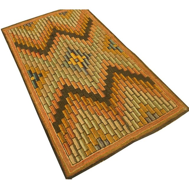1880 American Hooked Rug 3' 4"x5' 7" This circa 1880 American hooked rug, measuring approximately 3' 4" x 5' 7", is a...