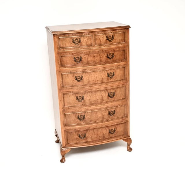 A stunning antique bow front burr walnut chest of drawers in the Georgian style. This was made in England, it dates from...