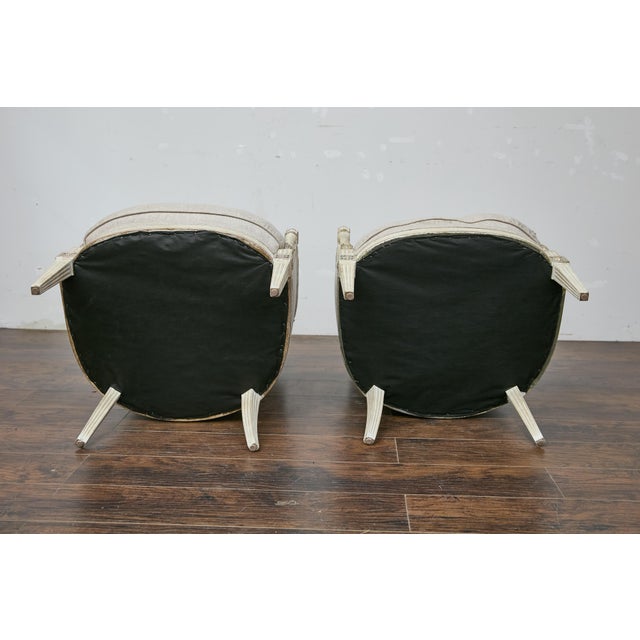 A pair of French Directoire style painted wood bergères chairs from the 19th century with twisted columns and new custom...