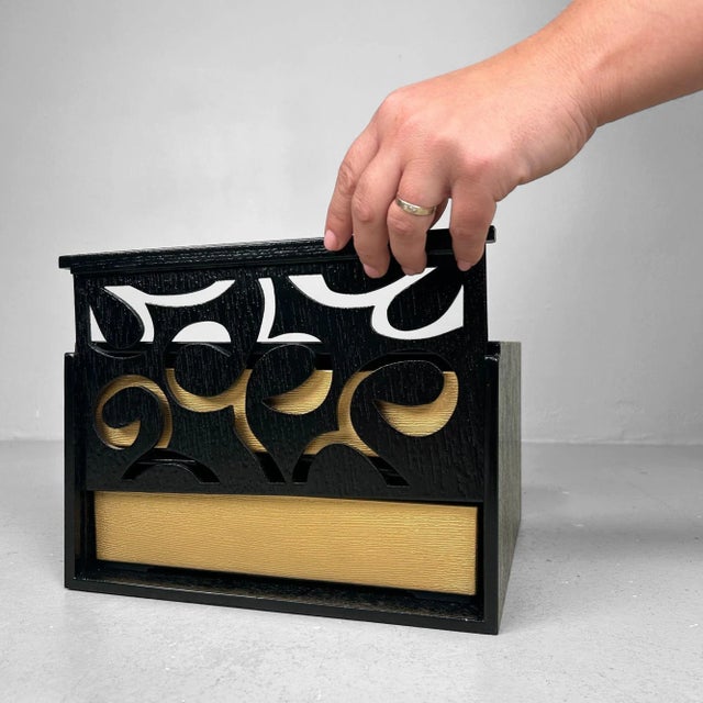 Elegant Japanese storage box with a sliding front panel concealing two gold-colored drawers. Dimensions: height 17 cm,...