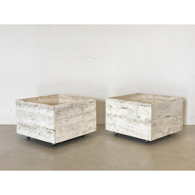Pair of 70s planters in travertine resting on wheels