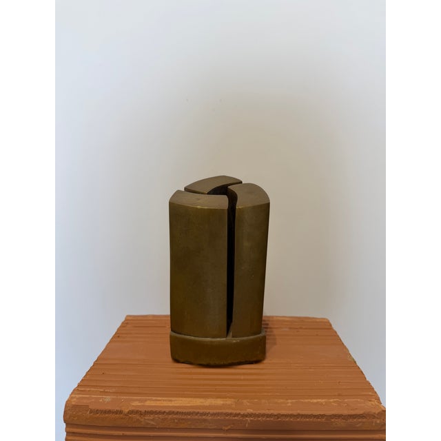 Brazilian modernist sculpture with three solid bronze curved pillars attached to a bronze base circa 1980s. Unsigned.