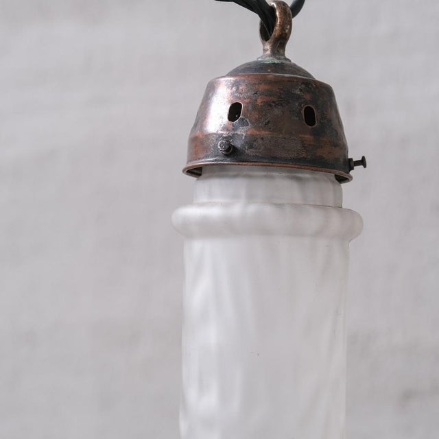 An unusual finish glass pendant light. France, 1960s. Cloudy opaque finish. Original gallery in naturally patinated metal....
