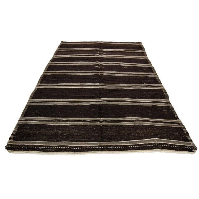 Striped handwoven vintage kilim rug from Afyon region of Turkey. Approximately 50-60 years old. In very good condition