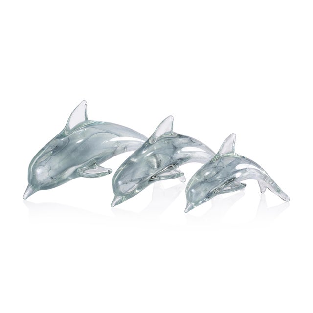 A stunning tribute to marine life, the Marinella Decorative Glass Dolphin captures movement and grace in hand-blown glass....
