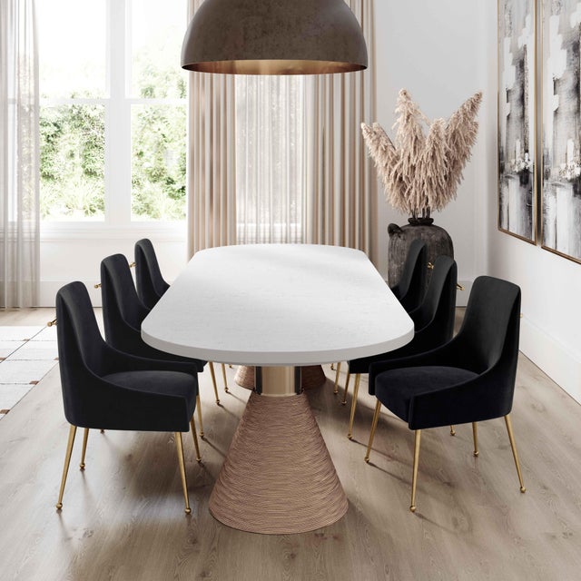 Coastal elements blend swimmingly with the modern silhouette of the Rishi Dining Table. Available in two size and color...