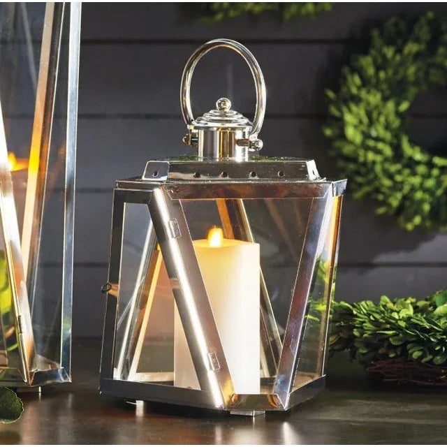 The Small Silver Adler Outdoor Lantern ADLER OUTDOOR LANTERN 12.5" 9.75 x 8.75 x 12.5 Nautical in style, the Adler Lantern...