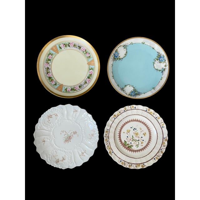 This set of 8 antique Limoges France mismatched floral dessert plates features a Victorian style with hand-painted floral...