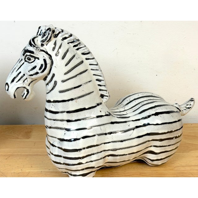 Pair of Italian Mid-Century Modern Glazed Pottery Zebra Sculptures in the Style of Raymor A whimsical and highly...