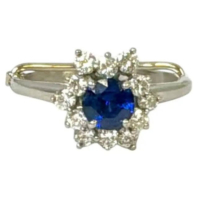 Vintage 1972 Tiffany & Co. PT950 Platinum Sapphire and Diamond Cluster Ring. At the center is a round faceted blue...