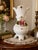 Elegant vintage Capodimonte porcelain trumpet vase featuring a distinctive flared silhouette, sculptural four-footed base,...