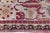 This striking Indian Agra runner is a carefully adjusted fragment of a larger antique carpet, meticulously repurposed to...