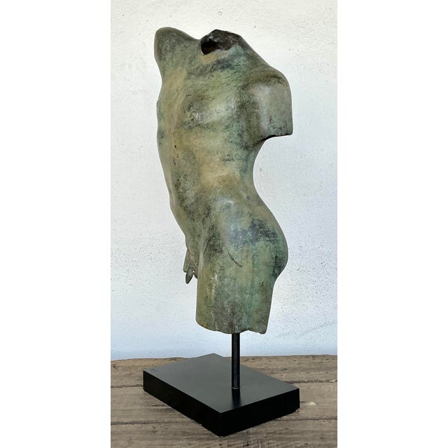 Capture the timeless beauty of antiquity with this striking vintage bronze sculpture of a male torso. Inspired by the...