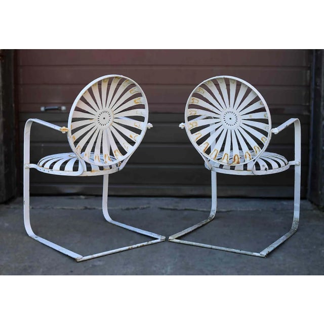 Set of four mid century French Art Deco cantilever garden chairs by Francois Carre. Wrought iron with rocking cantilevered...