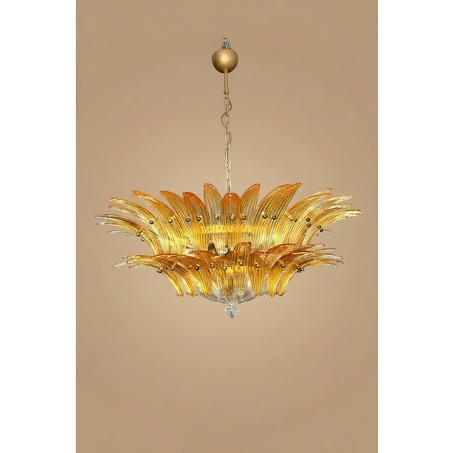 An extraordinary glass chandelier, entirely handmade in Italy, following the traditional Venetian glassmaking techniques...