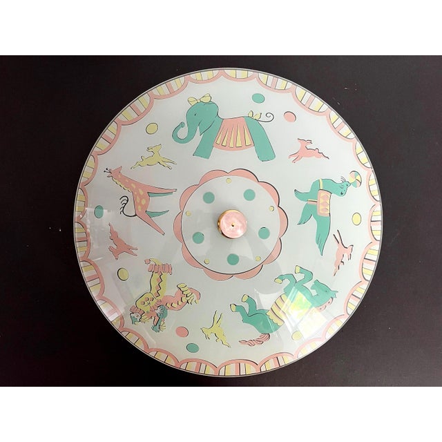 Adorable 1950s circus themed frosted glass flush mount light reverse painted with leaping dogs chasing balls, elephant,...