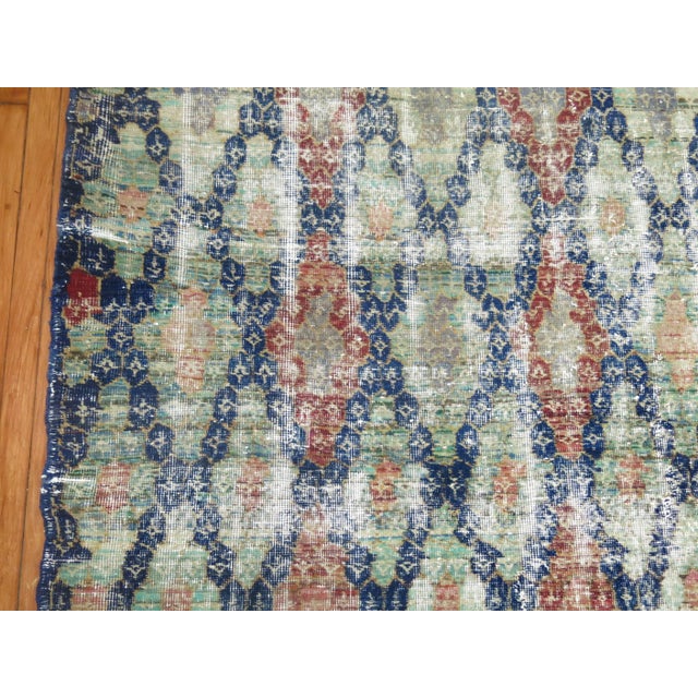 Shabby chic Turkish Anatolian carpet, navy blue field, predominant accents in green, soft red, soft orange, blue and gray....