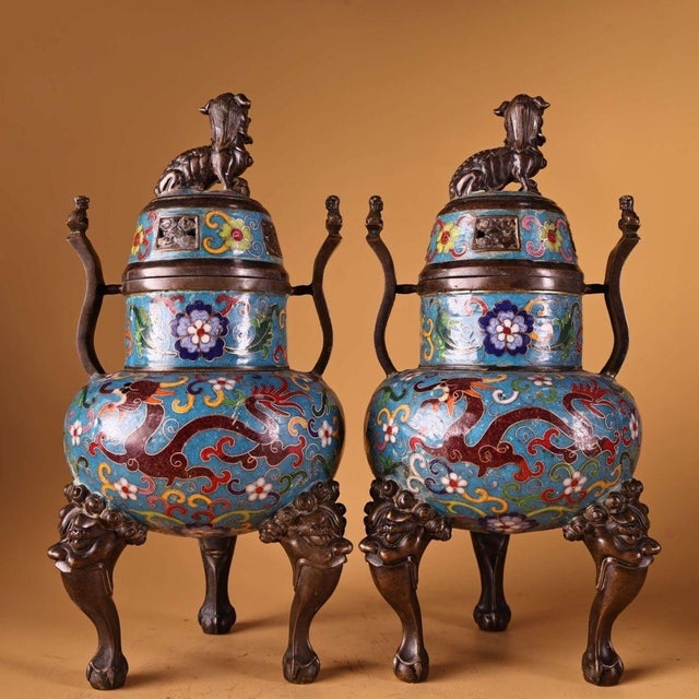 This is a striking and substantial pair of matching cloisonné enamel censers (incense burners). The vessels feature a...