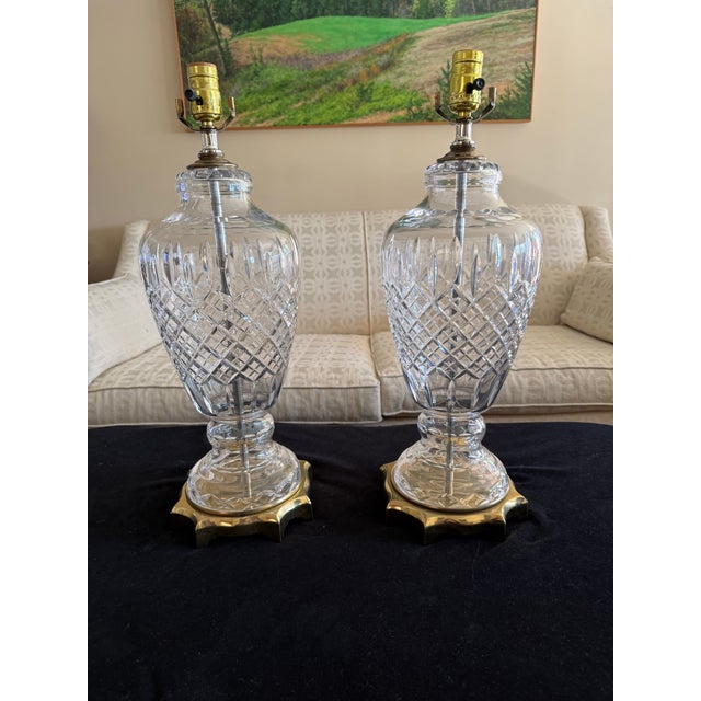 Large, Vintage , and substantial pair of Waterford style Crystal Table Lamps with geometric brass base. These lovely lamps...