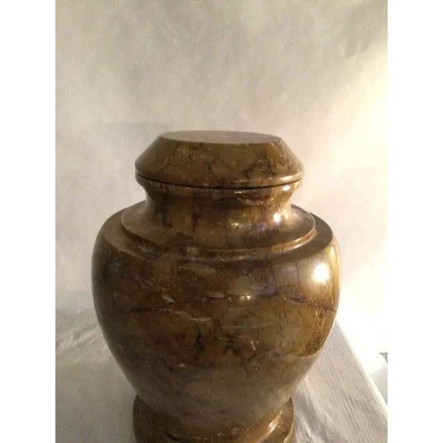 1970s Stone Jardiniere or Urn With Lid The urn has varying shades of earth tones and pebbles that you expect to find on...