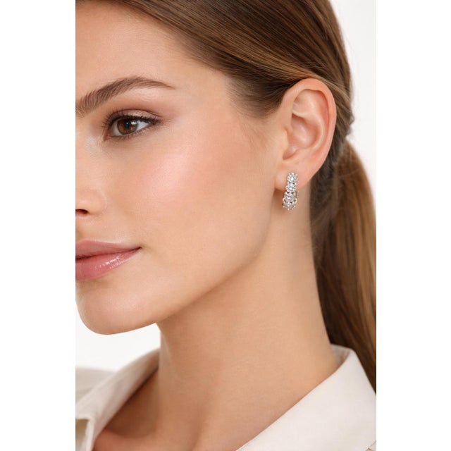 Elegant 14K white gold diamond huggies earrings set. With 10 diamonds totaling approximately 2.60 Carat Total Weight....