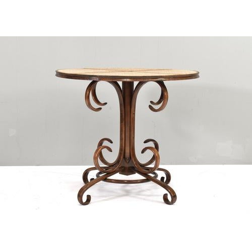 Bistro dining table in bentwood and cane designed by Michael Thonet. Originally designed in the 1860s and produced by...