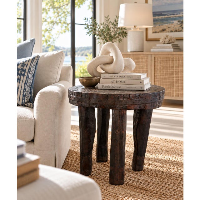 A remarkable antique hand-carved wood and iron side table dating to the early 20th century. Constructed from substantial...