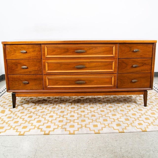 Clean 9 drawer dresser / credenza by unknown American furniture maker during the 60s era. Tons of storage throughout the...