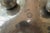 The artist's signature and the hallmark guaranteeing the purity of the tin are visible under the base, confirming its...
