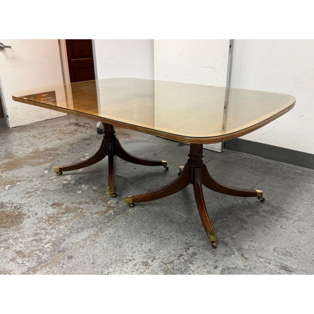 Design Plus Gallery presents a Double Pedestal Dining Table. The table is made with a mix of materials like mahogany and...