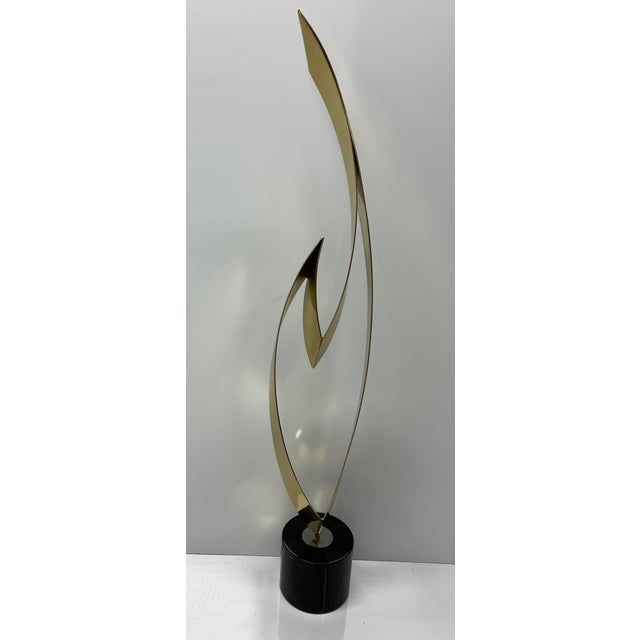 Large brass and marble sculpture by Curtis Jere. Brass with marble base. This is the beautiful and recognizable"Flame"...