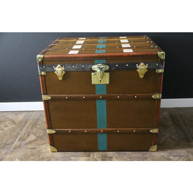 This beautiful and very rare Moynat trunk features a beautiful checkered canvas, honey-colored leather trim, large leather...