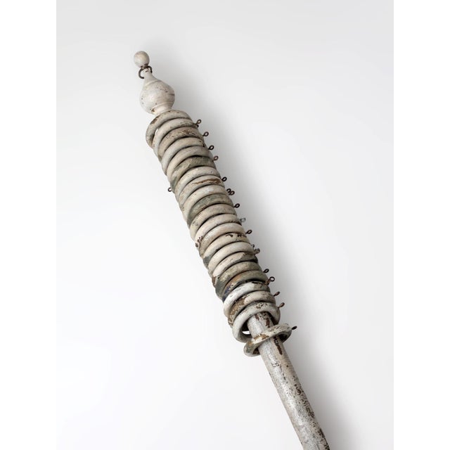This antique wooden curtain rod dates to the late 19th to early 20th century and features turned finials, a softly worn...