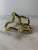 A miniature approx 3” mini tangle sculpture in gold. Based on the Tibetan infiny knot, this Richard X. Zawitz sculpture...
