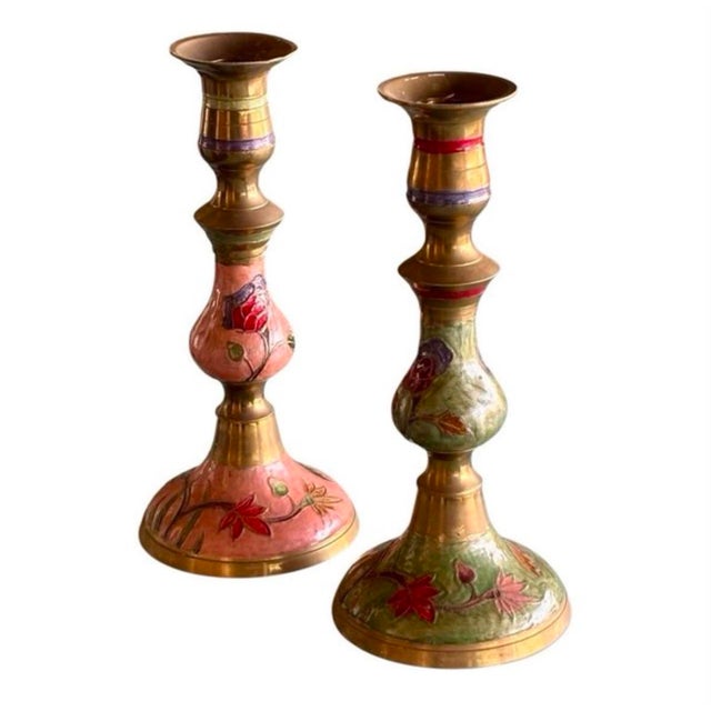 Art Nouveau candlesticks, circa 1890, made of brass and enameled with floral motifs in green and pink, a naturalistic...