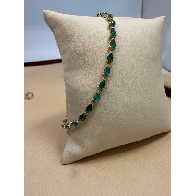 7 Ct Natural Pear Shape Emerald Cocktail Tennis Bracelet 14 Kt Yellow Gold 7" This exceptionally Beautiful Tennis bracelet...