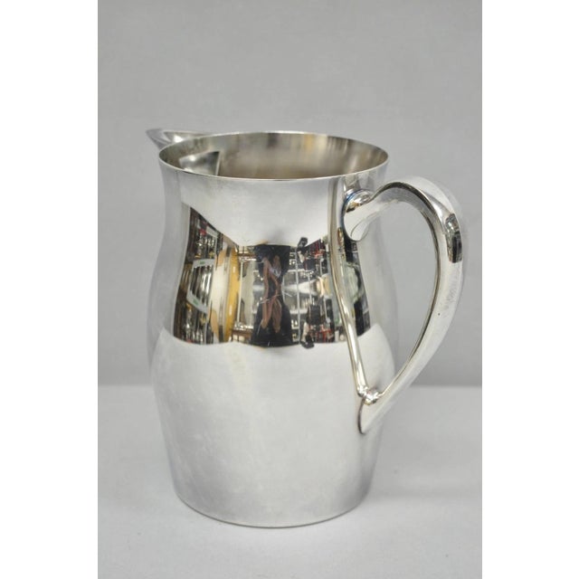 Vintage Bristol Silverplate by Poole B54 Silver Plated Mid Century Modern Bulbous Water Pitcher. Circa Mid 20th Century....