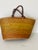 Antique Woven market basket with leather handles.