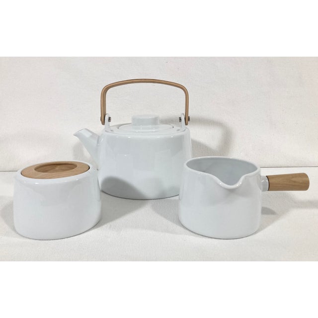 Set includes teapot, creamer and sugar bowl in excellent condition without any chips, cracks or discoloration. Like new...
