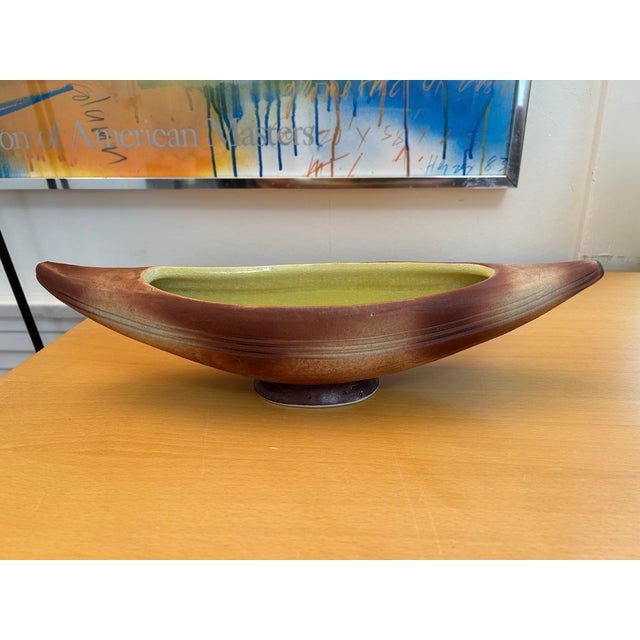 Beautiful canoe shaped vintage ceramic footed ikebana vase in a matte brown air-sprayed glaze outside and glossy crackle...