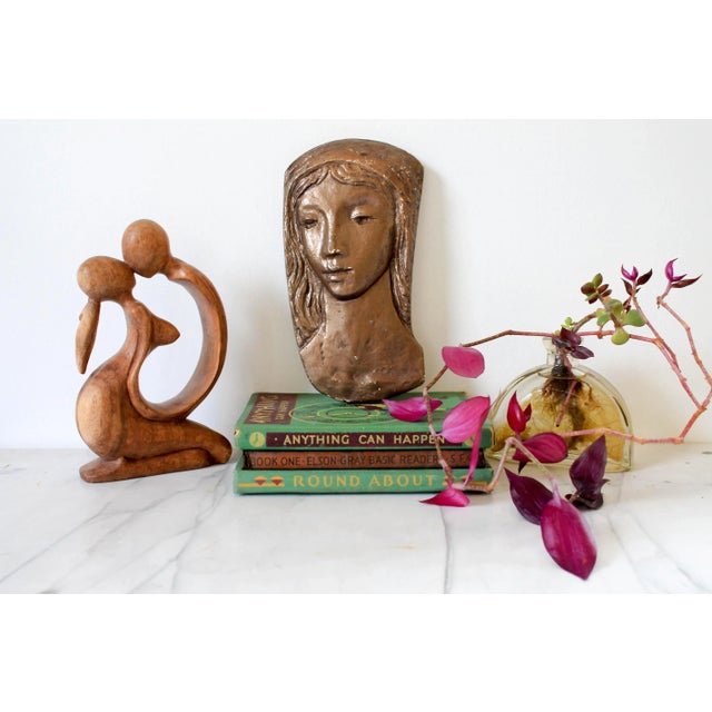 Vintage female plaster wall hanging. No makers mark. Some age wear to painted finish. Ready to hang.