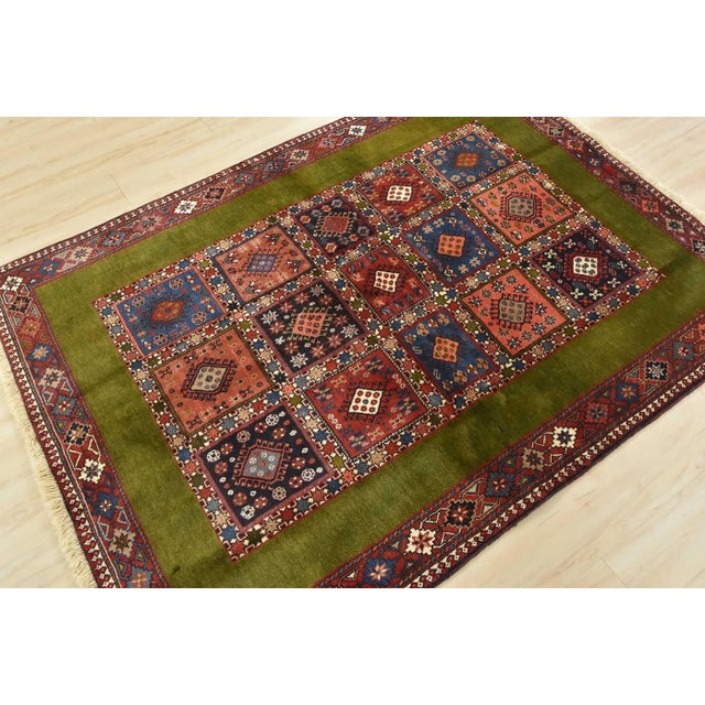 An authentic vintage tribal Yalameh rug hand-knotted with fine wool and natural dyes. This finely woven nomadic rug...